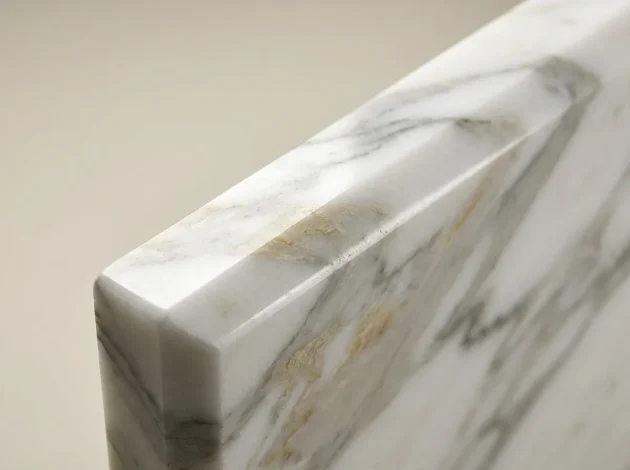 Close-up of the polished bevelled edge of a Calacatta Gold Marble threshold
